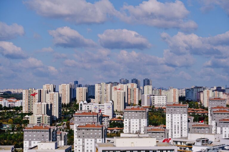 Panoramic view of modern residential buildings in Istanbul, Turkey under a bright sky.