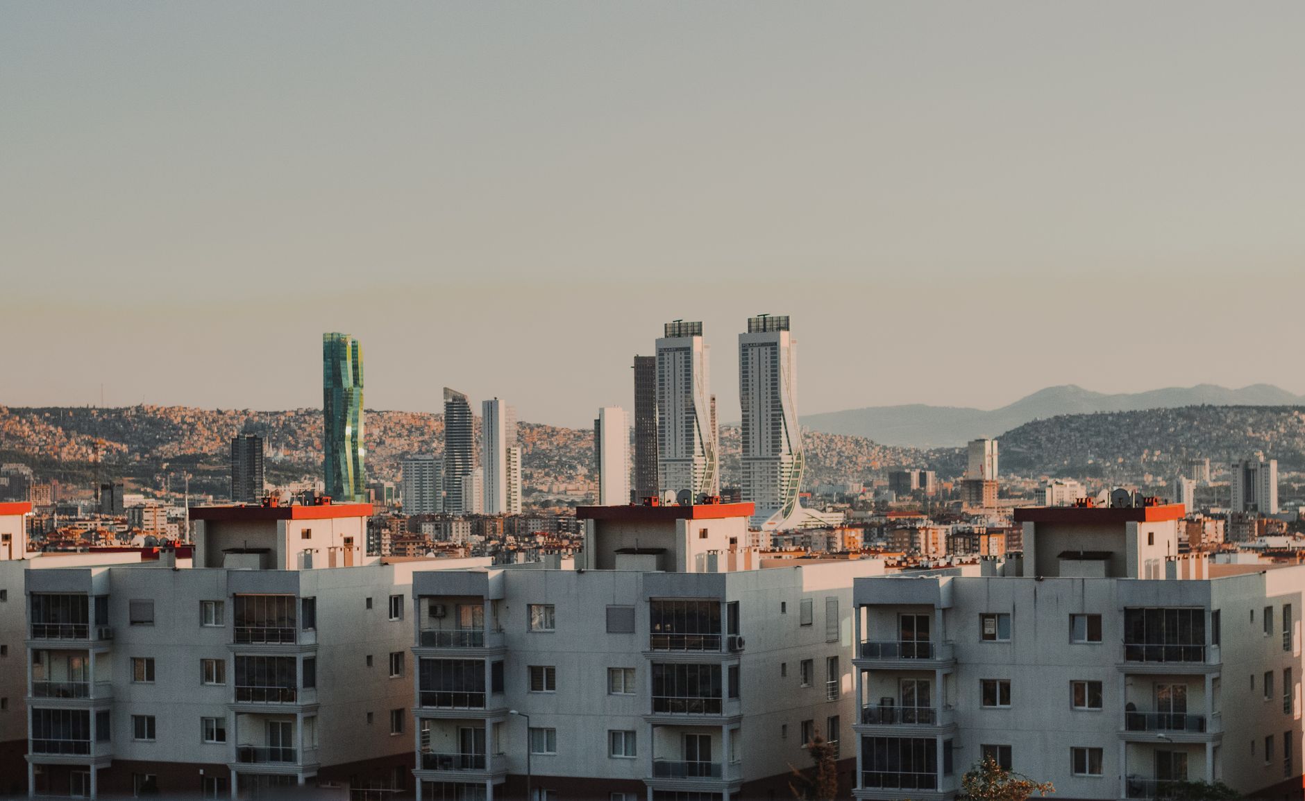 A captivating view of Istanbul featuring modern skyscrapers and residential buildings under a clear sky.